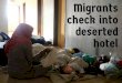 Migrants check into deserted hotel