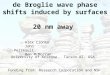 de Broglie wave phase shifts induced by surfaces  20 nm away
