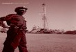 A security guard stands near an ExxonMobil rig in Kome, southern 
